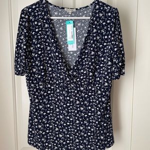 NWT Navy wrap top with gray floral print.
